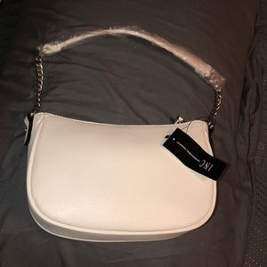 small plain white purse